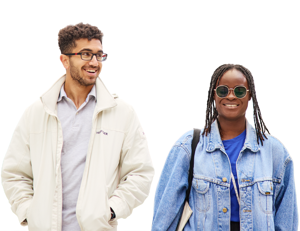 Two students walking side by side and smiling