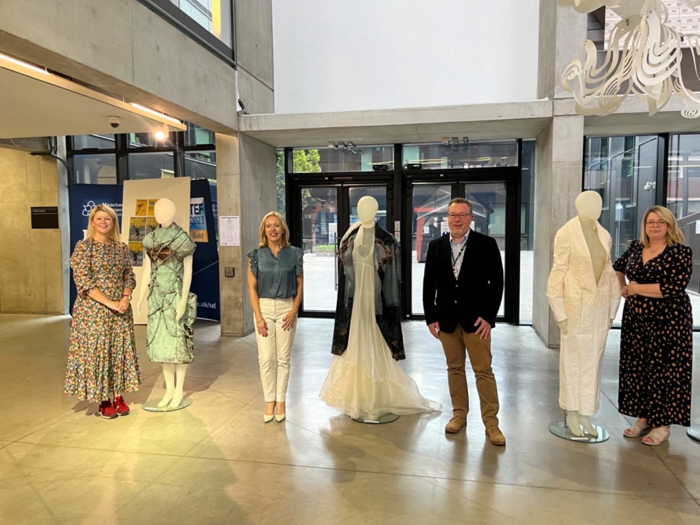 Colleagues from Manchester City Council, the Honorary Consul of Japan in Manchester Jo Ahmed and Faculty Pro Vice Chancellor Professor Martyn Evans viewing the McQueen COIL project outcomes. 