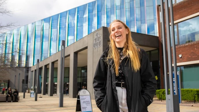 Student stood outside the Business School.