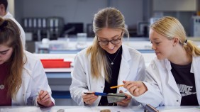 Student conducting experiment in university laboratory