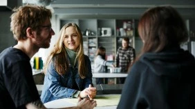 Students in discussion in one of the studio spaces on campus