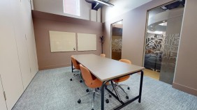 A study room with a table and chairs at Lambert and Fairfield House.
